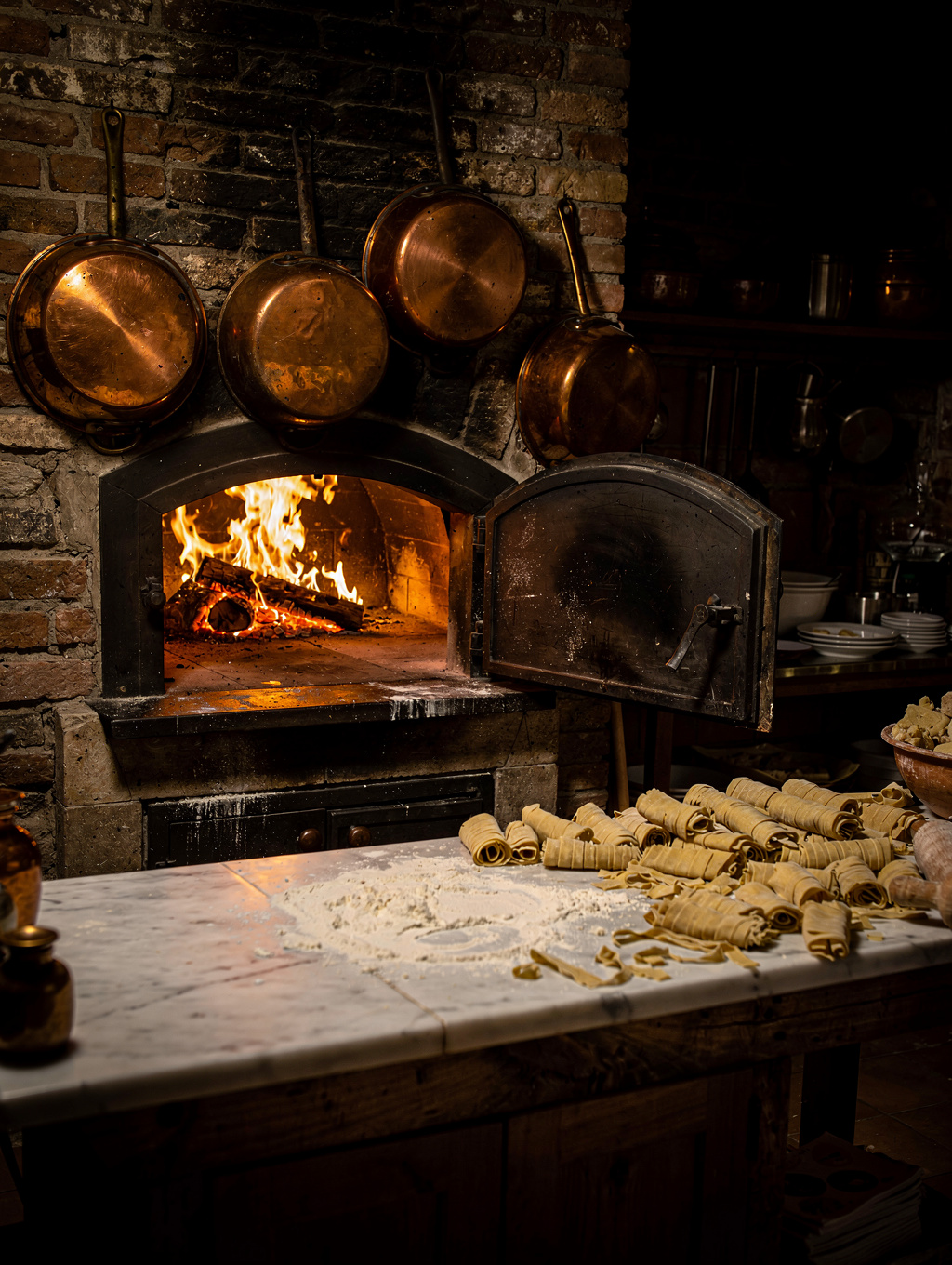 Chef preparing fresh handmade pasta in our open-concept Italian kitchen